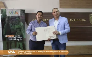 Foto de viva mi casa donde podemos observar el gerente de VIVA junto a funcionario en la firmatón